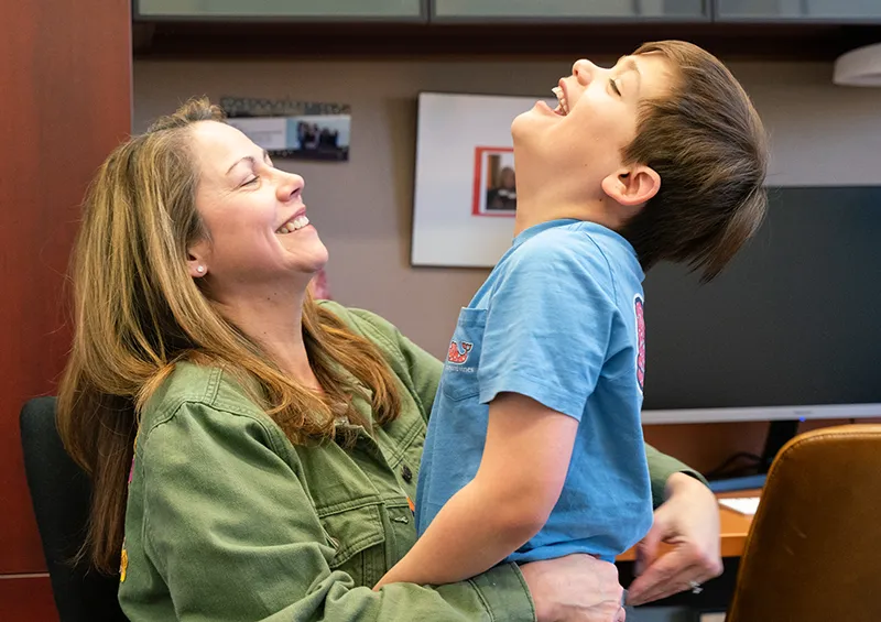 autistic child laughing with parent in northwestern neurodevelopmental diversity lab