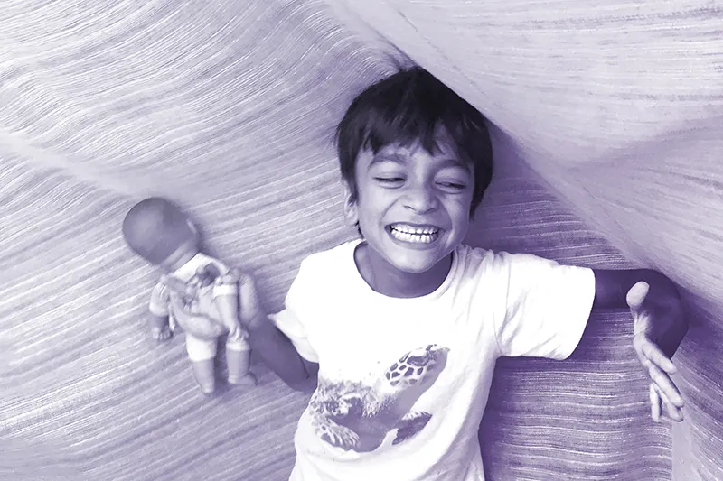northwestern-ndl-fragile-x-study child with fragile x playing happily research study northwestern neurodevelopmental diversity lab